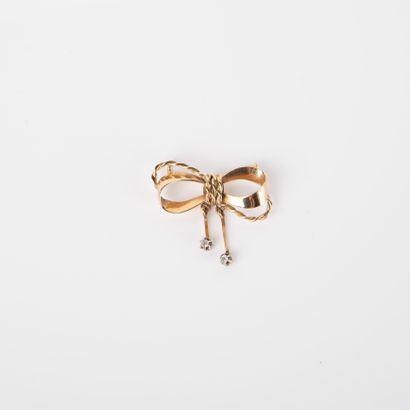 Bow-shaped pendant adorned with two old-cut...