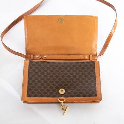 CELINE
Monogram canvas and brown leather...