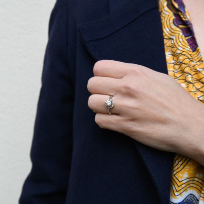 Sun-set solitaire ring with a modern-cut...