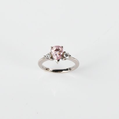 Ring adorned with a pear-shaped sapphire,...
