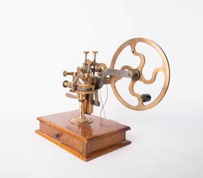Brass and metal watchmaker's lathe on wooden...