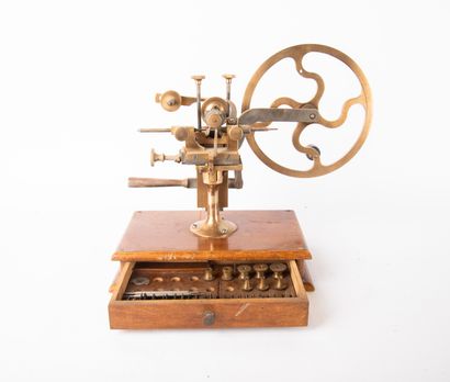 Brass and metal watchmaker's lathe on wooden...