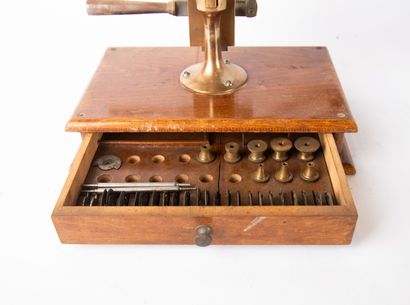 Brass and metal watchmaker's lathe on wooden...
