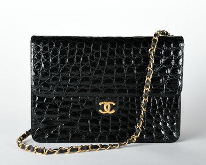 CHANEL. Circa 1980/1985. Black aligator leather...