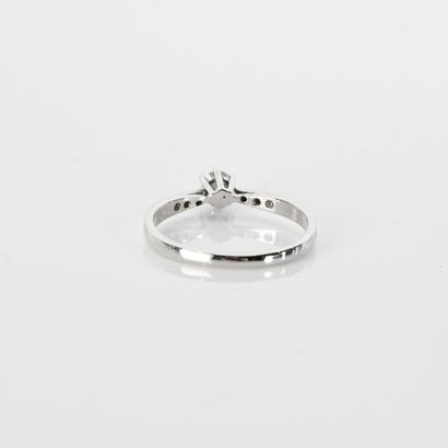 Solitaire centered with a modern-cut diamond...