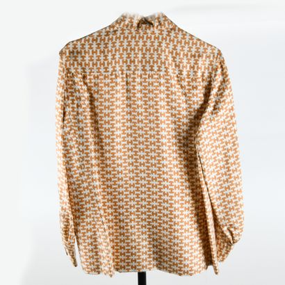 HERMES Sport. Silk blouse decorated with...