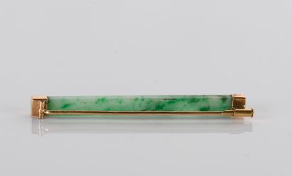 Jade and jadeite brooch on an
18-carat yellow...
