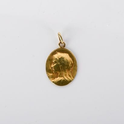 Unencrypted oval medal of the Virgin Mary...