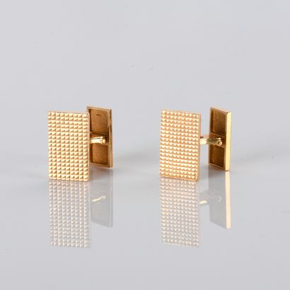 Pair of yellow gold cufflinks with diamond-patterned...