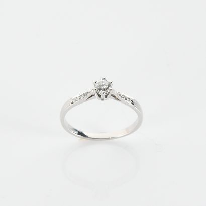 Solitaire centered with a modern-cut diamond...