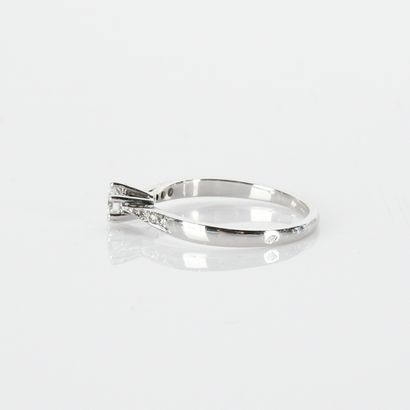 Solitaire centered with a modern-cut diamond...