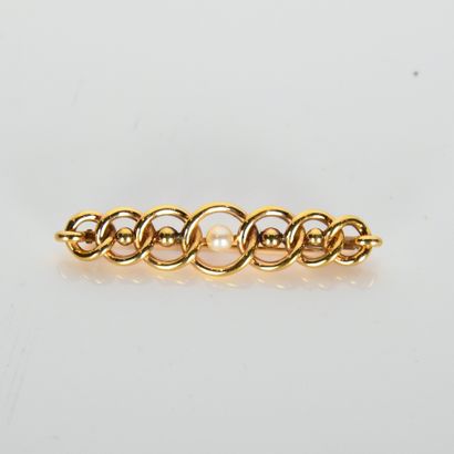 18K (750 thousandths) yellow gold brooch...