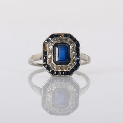 Art Deco period ring centered on a sapphire...