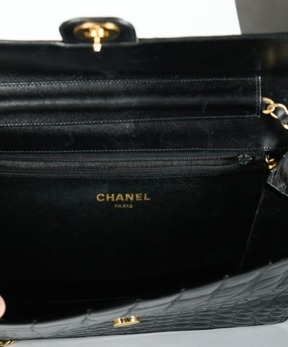 CHANEL. Circa 1980/1985. Black aligator leather...