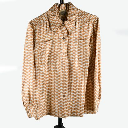 HERMES Sport. Silk blouse decorated with...