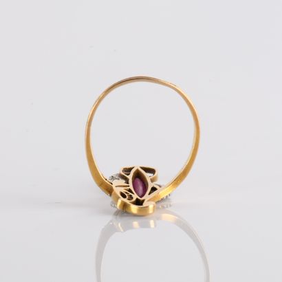 Floral ring set with a red imitation stone
stone,...