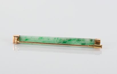 Jade and jadeite brooch on an
18-carat yellow...