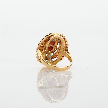 Oval ring entirely paved with garnets on...