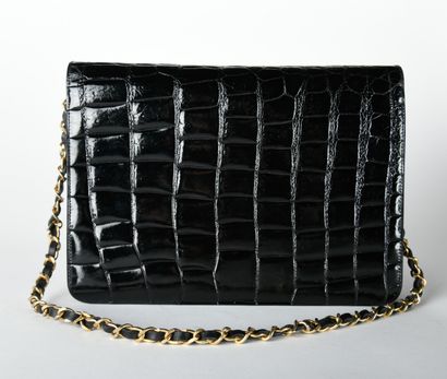CHANEL. Circa 1980/1985. Black aligator leather...