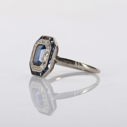 Art Deco period ring centered on a sapphire...