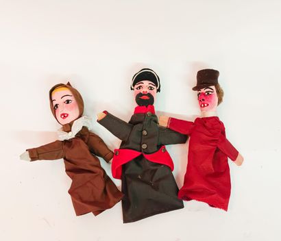 Three Lyon-type puppet heads in carved wood...