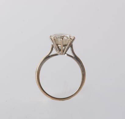 Solitaire set with a demitaille diamond weighing...