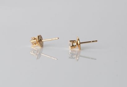 Pair of ear studs in yellow gold
18K (750°/00...
