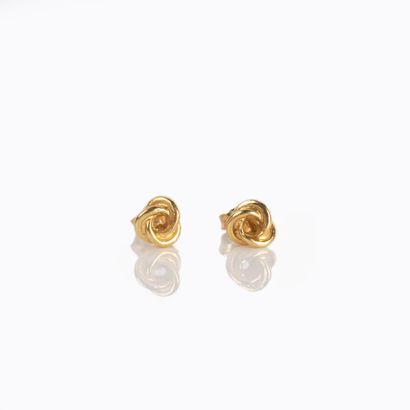 Pair of earrings representing a knot, in...