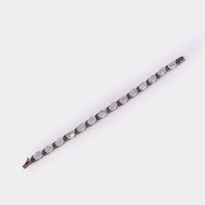 Silver bracelet set with moonstone cabochons...
