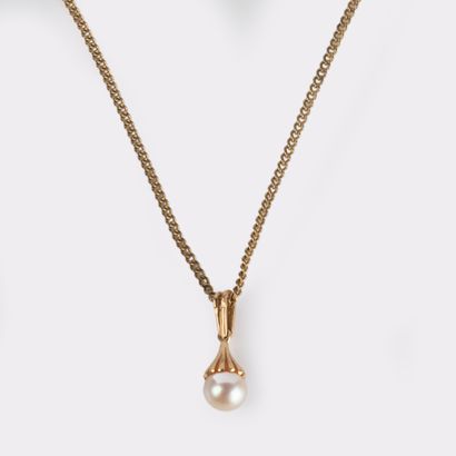 18K (750°/00) yellow gold pendant holding...