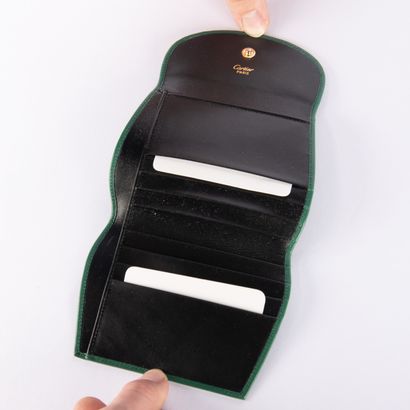 CARTIER, Must
Green leather wallet, in its...
