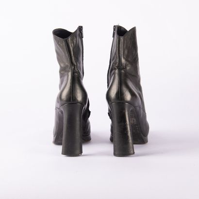 Four pairs of black heeled boots. 1/ CHARLES...