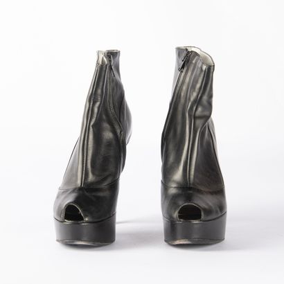 Four pairs of black heeled boots. 1/ CHARLES...