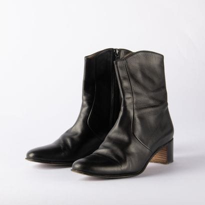 HERMÈS. Pair of black leather ankle boots...