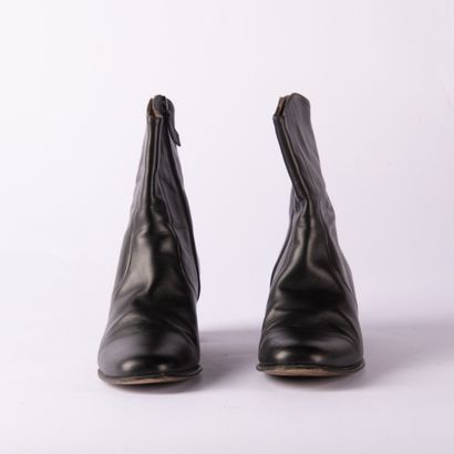 HERMÈS. Pair of black leather ankle boots...