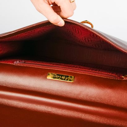 CARTIER, Must
Bordeaux leather briefcase
27.5...