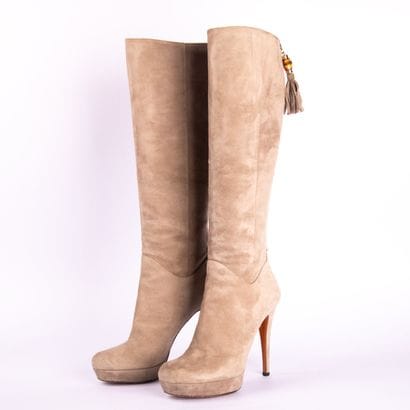 GUCCI. Heeled boots in gray suede calfskin,...