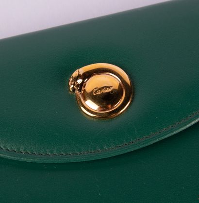 CARTIER, Must
Green leather wallet, in its...