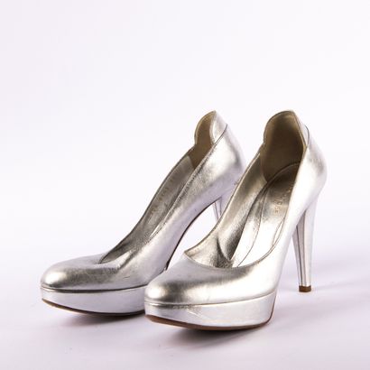 Lot of three pairs of shoes
PRADA. Red leather...