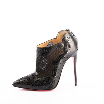 CHRISTIAN LOUBOUTIN. Pointed-toe black leather...