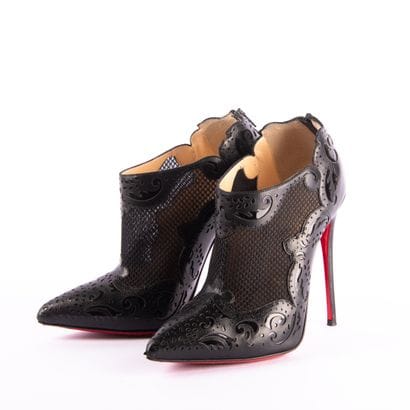 CHRISTIAN LOUBOUTIN. Pointed-toe black leather...