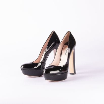 MIU MIU. Pair of black patent leather platform...