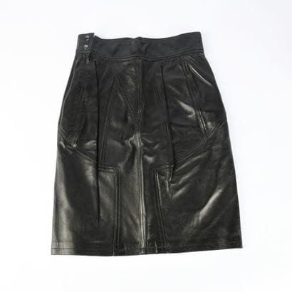 ALAÏA PARIS. Black leather skirt, snap button...