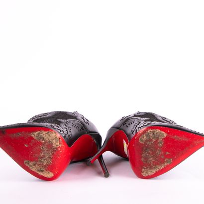 CHRISTIAN LOUBOUTIN. Pointed-toe black leather...