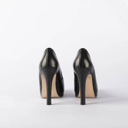 Lot of four pairs of black pumps. 1/ BRUNO...