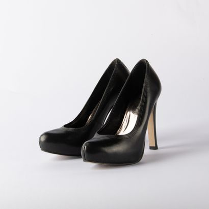 Lot of four pairs of black pumps. 1/ BRUNO...