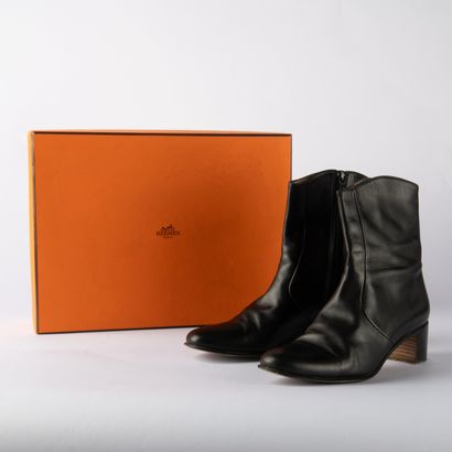 HERMÈS. Pair of black leather ankle boots...