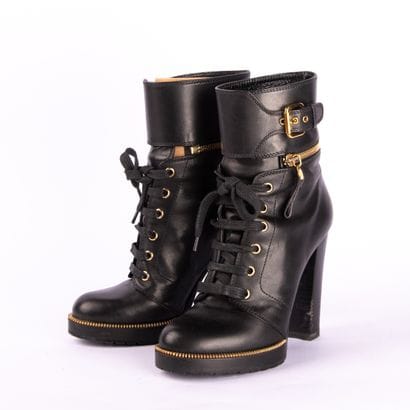 SERGIO ROSSI. Black leather heeled boots,...