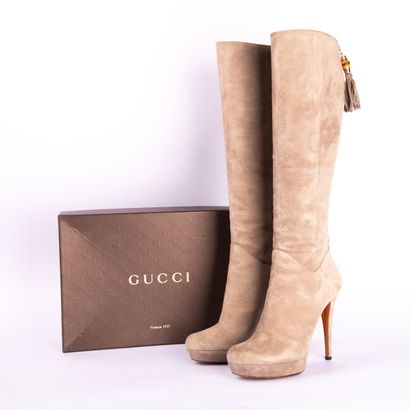 GUCCI. Heeled boots in gray suede calfskin,...