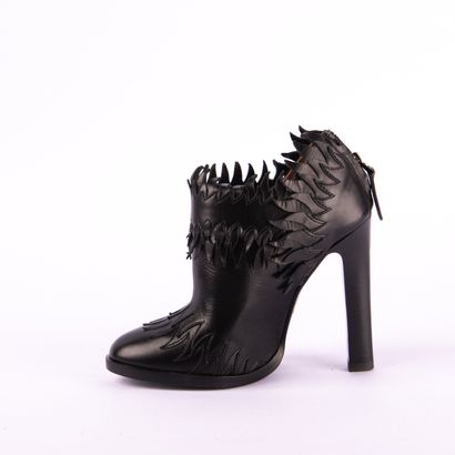 ALAÏA PARIS. Heeled boots with round toes...
